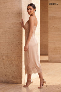 Champagne Lace V-Neck Slip Dress – worn by model, travertine setting