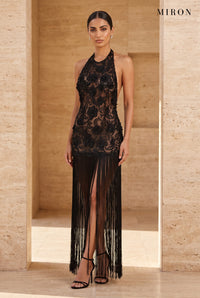 Black Lace Halter Tassel Dress – worn by model, travertine setting