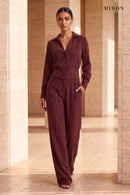 Burgundy Cupro Shirt & Trouser Set – worn by model, travertine setting