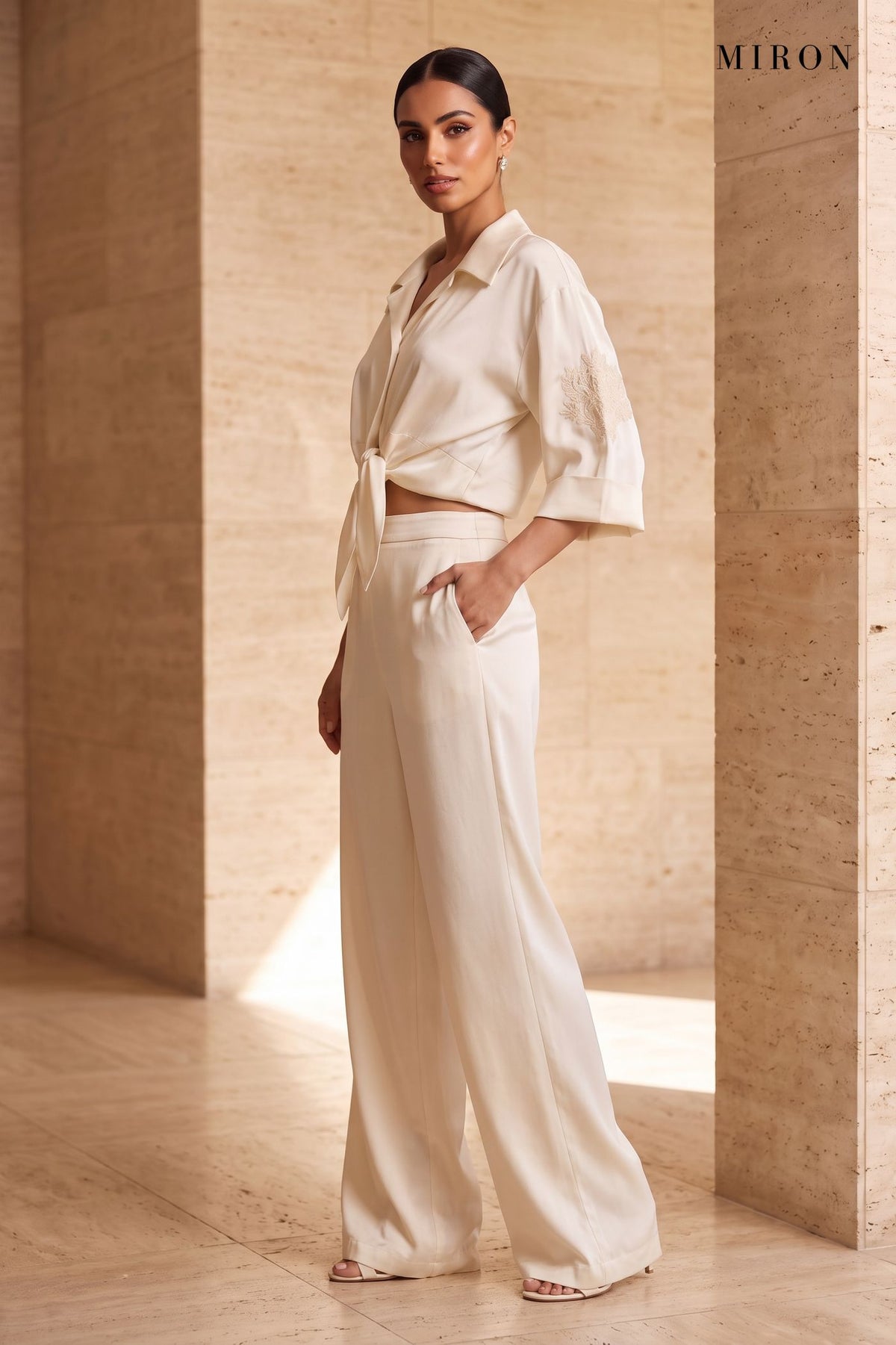 Cream Satin Set with Embroidered Sleeves – worn by model, travertine setting