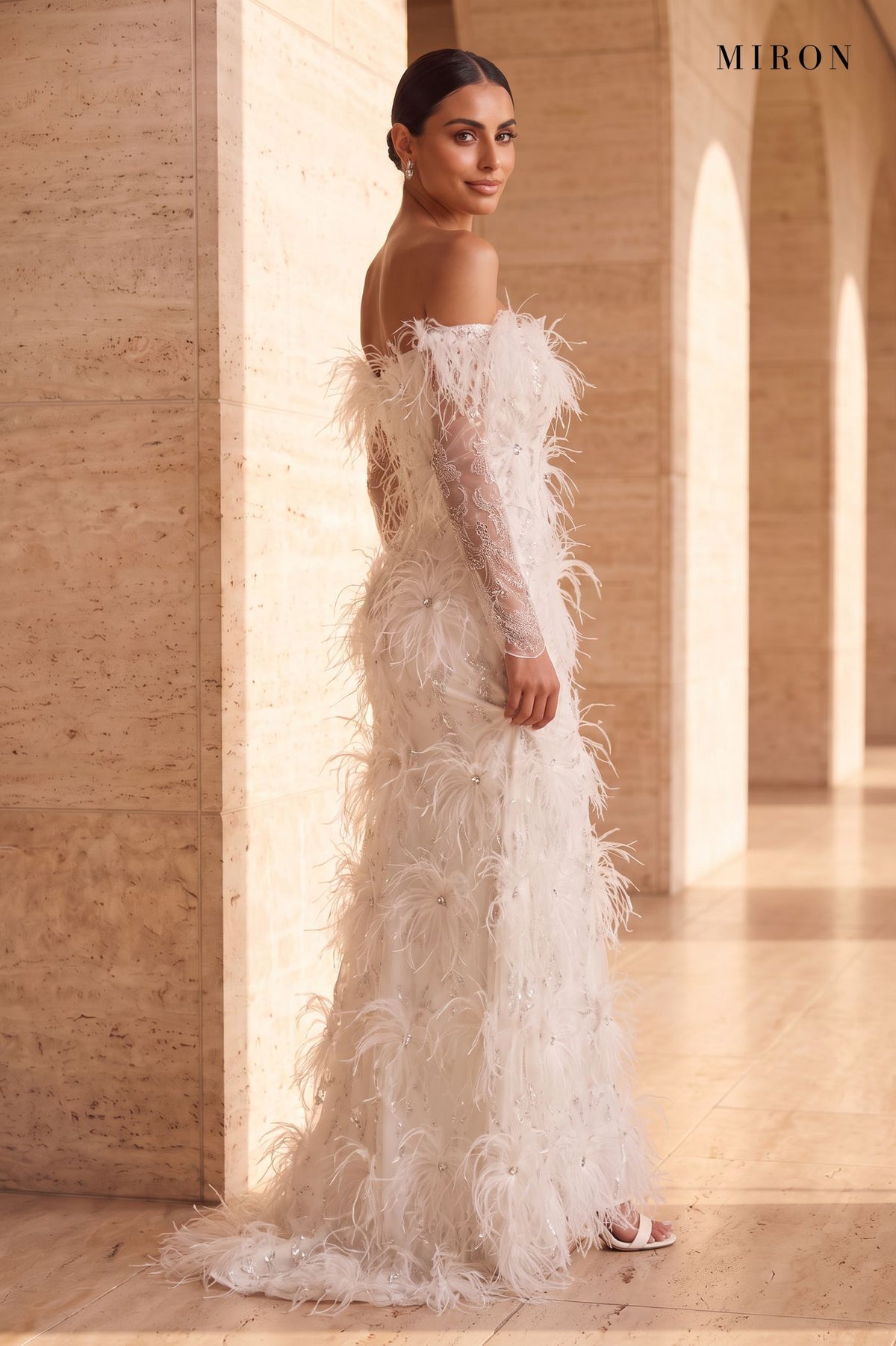 White Feather Off-Shoulder Gown – worn by model, travertine setting